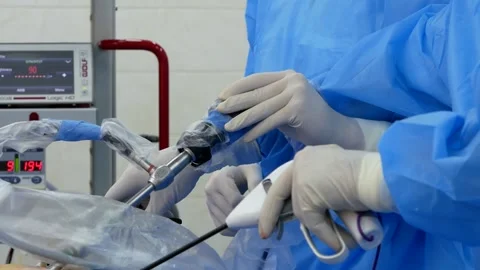 Doctors surgeons operate laparoscope during a laperoscopy surgical operation Stock Footage 234318343