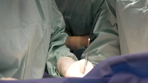 Doctors surgeons perform surgery in the operating room. Stock Footage 292007682