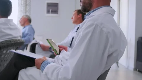 Doctors taking notes during medical seminar Stock Footage 316911743