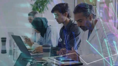 Doctors tapping devices reviewing data, animated charts rising in overlay, Stock Footage 330052754