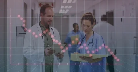 Doctors tapping tablet and taking notes while reviewing data as health grid Stock Footage 317869473