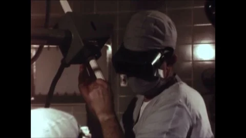 Doctors use pulse lasers to burn away tumorous celled skin on a mans arm in Stock Footage 86498861