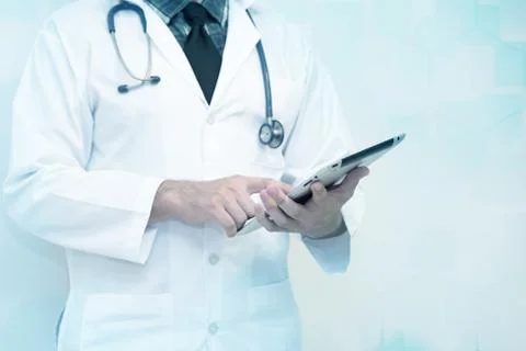 Doctors use the smart tablet  PC  with copy space for healthcare design Stock Photos