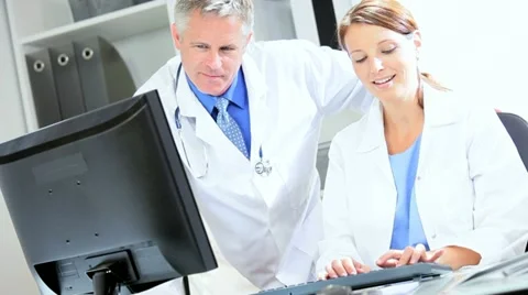 Doctors Using Clinical Computer Data Video stock 11367552