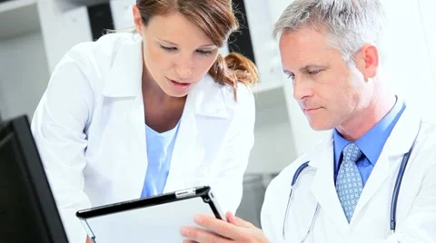 Doctors Using Clinical Computer Data Stock Footage 11368300