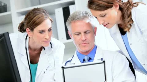 Doctors Using Clinical Tablet Data Stock Footage 11372267