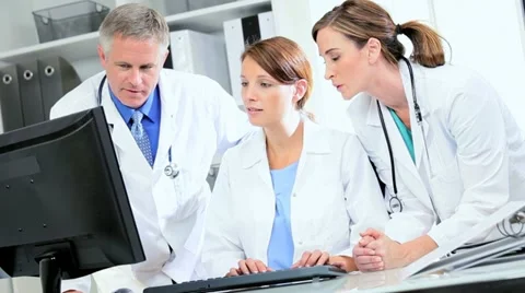 Doctors Using Patient Clinical Computer Data Stock Footage