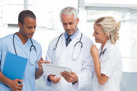 Doctors using a tablet Stock Photos