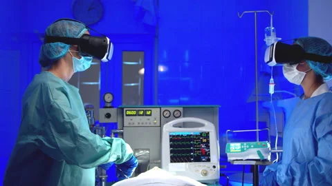 Doctors in VR glasses performing surgery in hospital Stock Footage 140760346