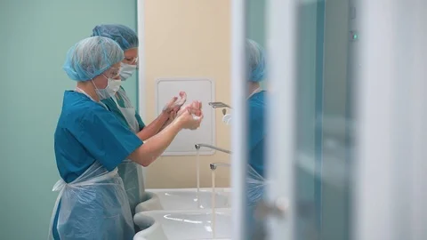 Doctors wash their hands thoroughly, disinfection Stock Footage 126928124