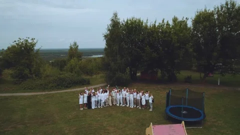 Doctors wave at the drone, doctors look at the camera Stock Footage 314312945