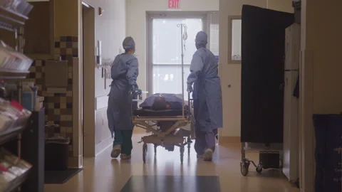 Doctors Wheeling Patient To The Operatin... | Stock Video | Pond5