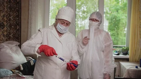 Doctors work at the patient's home Stock Footage 139770845