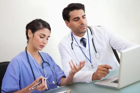 Doctors working with a laptop Stock Photos