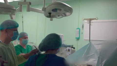 Doctors working in the operating room Stock Footage 91230519