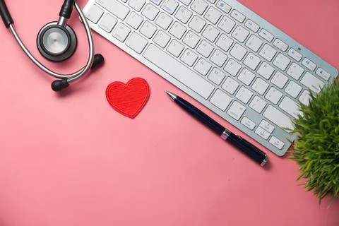Doctors workplace with container, keyboard and prescription on desk. Stock Photos