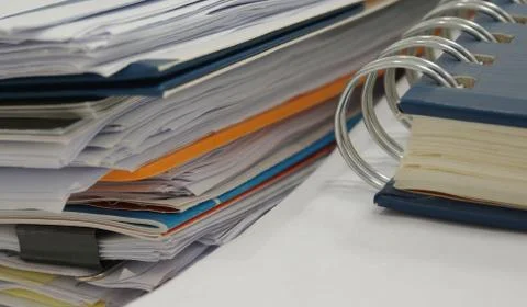 Document and notebook at office Stock Photos