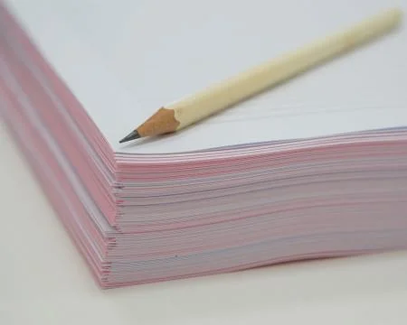 Document and pencil on table Stock Photos