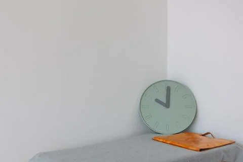 Document bag and clock on the table with empty space. Concept of work and time. Stock Photos