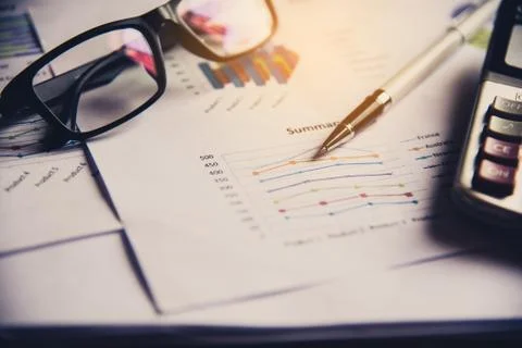Document Book Pen Graph Calculator And accounting documents placed on the des Stock Photos