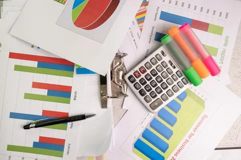 Document color graph sheet for presentation with equipment calculator Stock Photos