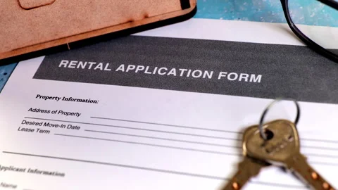 Document to complete rental application process for housing Stock Footage 302213145