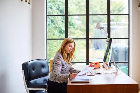 Document, computer and creative woman in office for research, project management Stock Photos