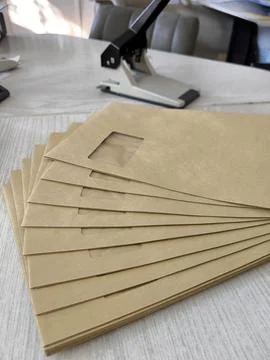 Document flow: a stack of craft envelopes for mailing 스톡 사진