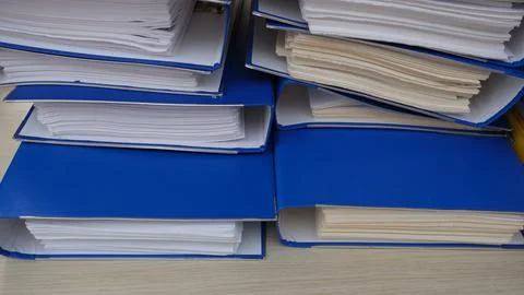 Document folder. Folders full of documents. Working in the office. Stock Photos