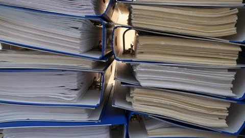 Document folder. Folders full of documents. Working in the office. Stock Photos