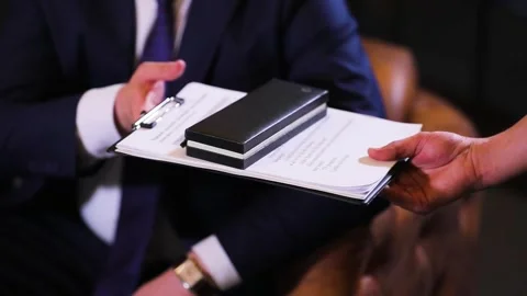 Document giving hand to hand slow motion. Pen case Stock Footage 155112824