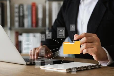 Document management system concept, business man holding folder and document  Stock Photos