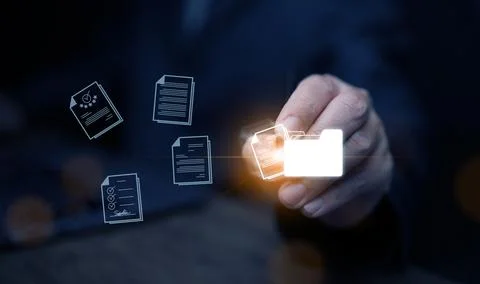 Document Management System concept. A man drags and drops files into DMS so.. Fotos de archivo
