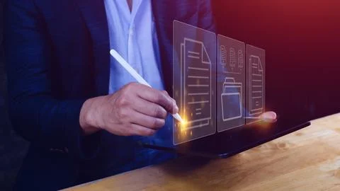 Document Management System (DMS) being setup IT consultant working on lapto.. Stock Photos