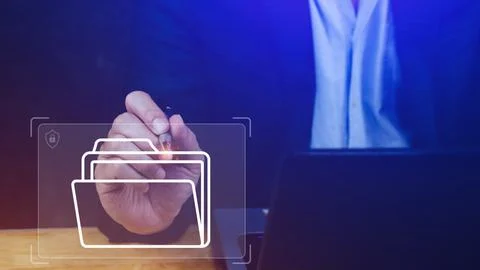 Document Management System (DMS) being setup IT consultant working on lapto.. Stock Photos