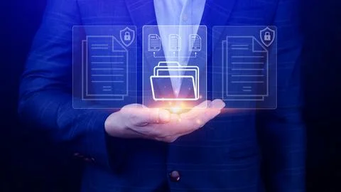Document Management System (DMS) being setup IT consultant working on lapto.. Stock Photos