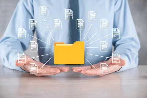 Document Management System DMS .Businessman hold folder and document icon.Sof Stock Photos