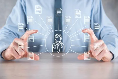 Document Management System DMS .Businessman hold doctor and document icon.Sof Stock Photos