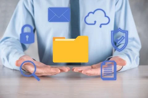 Document Management System DMS .Businessman hold folder and document icon.Sof 库存照片