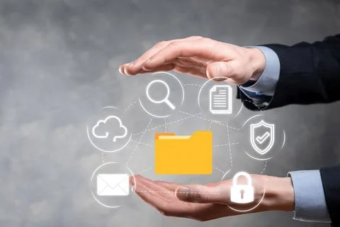 Document Management System DMS .Businessman hold folder and document icon.Sof Stock Photos