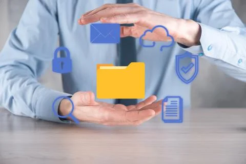 Document Management System DMS .Businessman hold folder and document icon.Sof Stock Photos