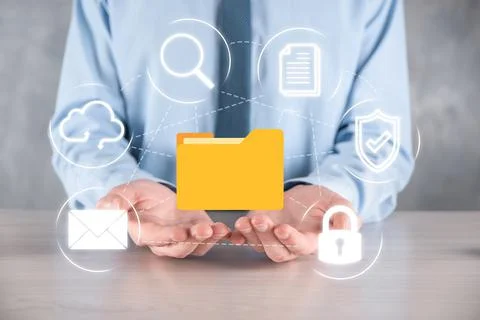 Document Management System DMS .Businessman hold folder and document icon.Sof 写真素材