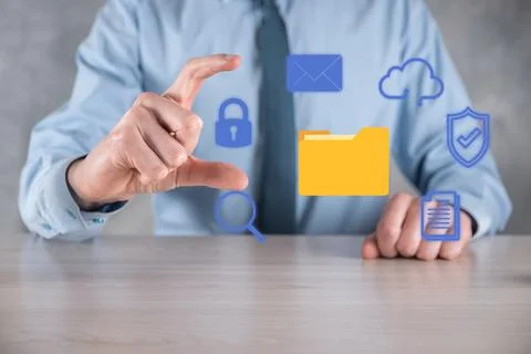 Document Management System DMS .Businessman hold folder and document icon.Sof Stock Photos