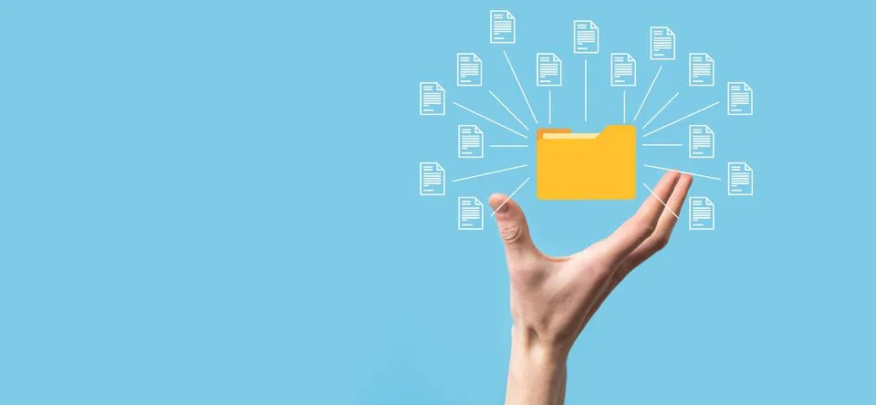 Document Management System DMS .Businessman hold folder and document icon.Sof Stock Photos