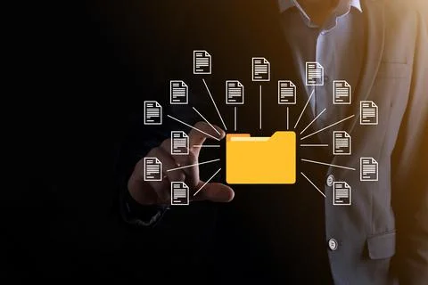 Document Management System DMS .Businessman hold folder and document icon.Sof Stock Photos