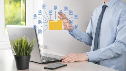 Document Management System DMS .Businessman hold folder and document icon.Sof 写真素材