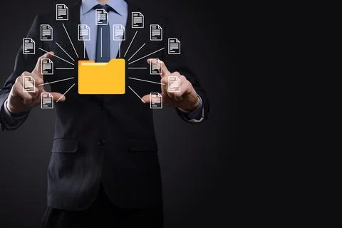 Document Management System DMS .Businessman hold folder and document icon.Sof 写真素材