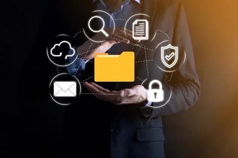 Document Management System DMS .Businessman hold folder and document icon.Sof 写真素材