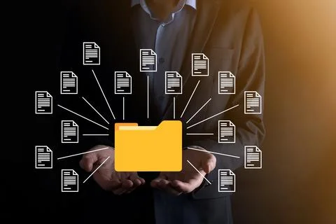 Document Management System DMS .Businessman hold folder and document icon.Sof 库存照片