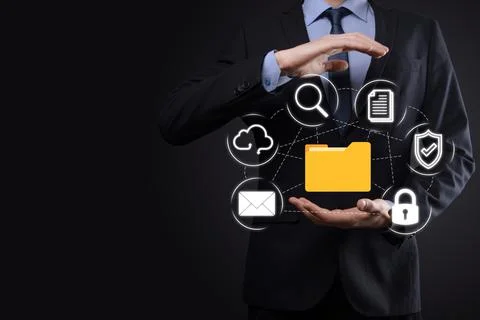 Document Management System DMS .Businessman hold folder and document icon.Sof 写真素材